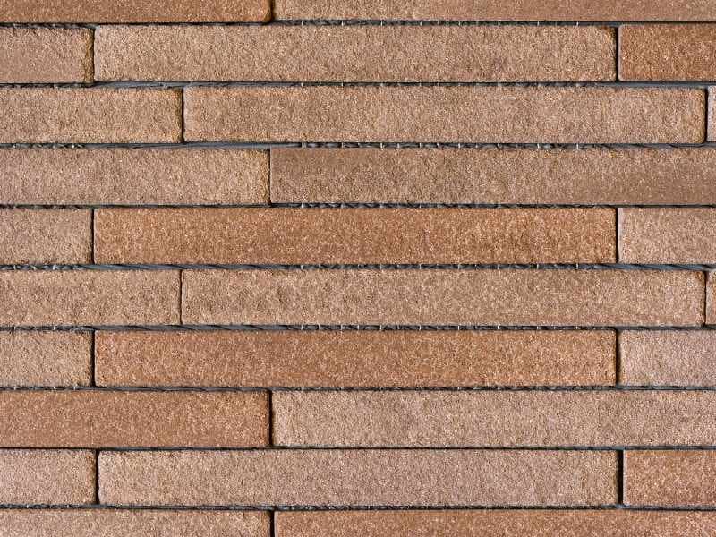 Thin brick veneer adding texture to an outdoor wall, kitchen, or fireplace.
